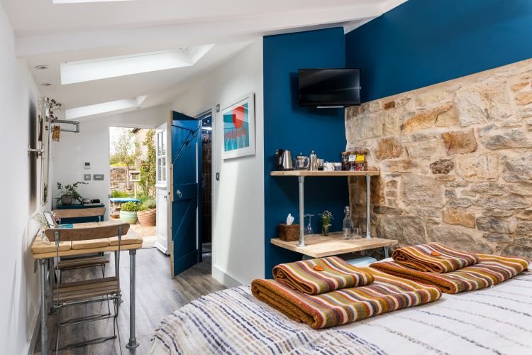 A cosy garden room AirBNB in Cornwall captured by a professional interiors photographer.